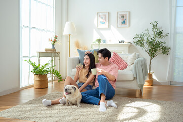 Couple Enjoys Cozy Morning Together With Their Pet Dog in a Bright Living Room Setting